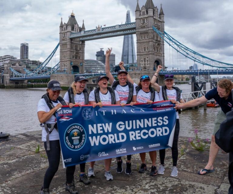 Six female rowers celebrating their world record