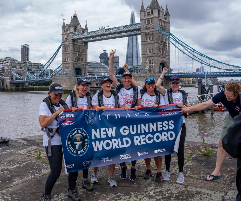 Six female rowers celebrating their world record