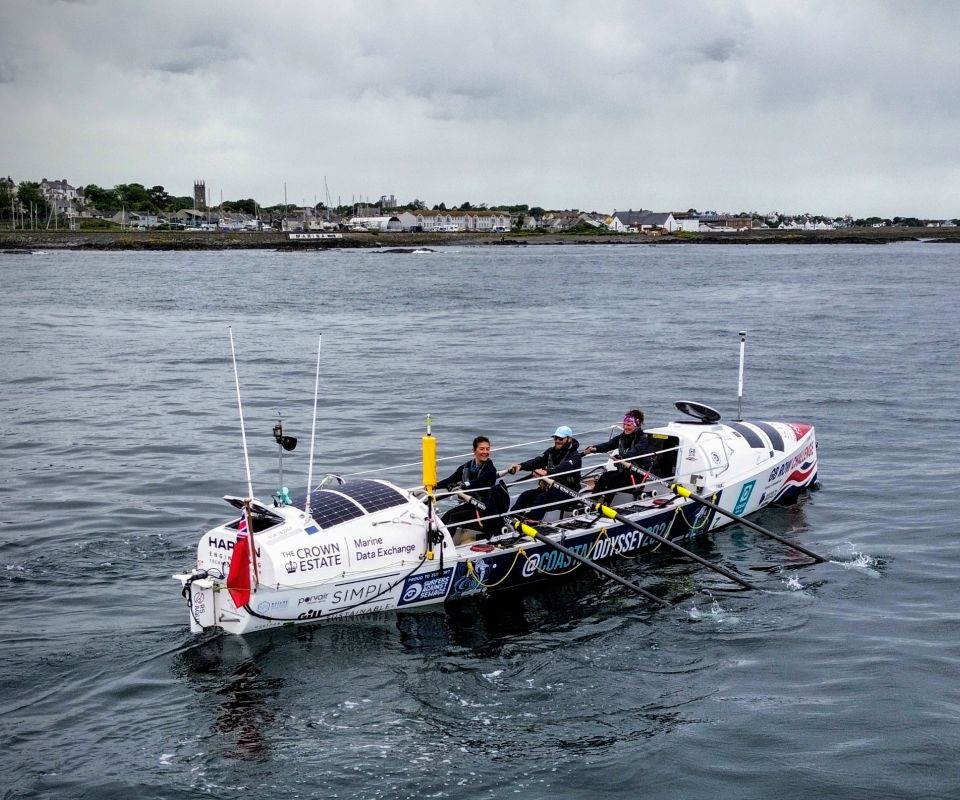 Team Coastal Odyssey rowing past Donaghadee